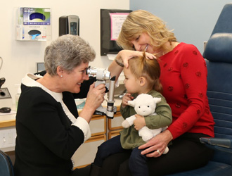 Dr. Mullon Treating Child Patient
